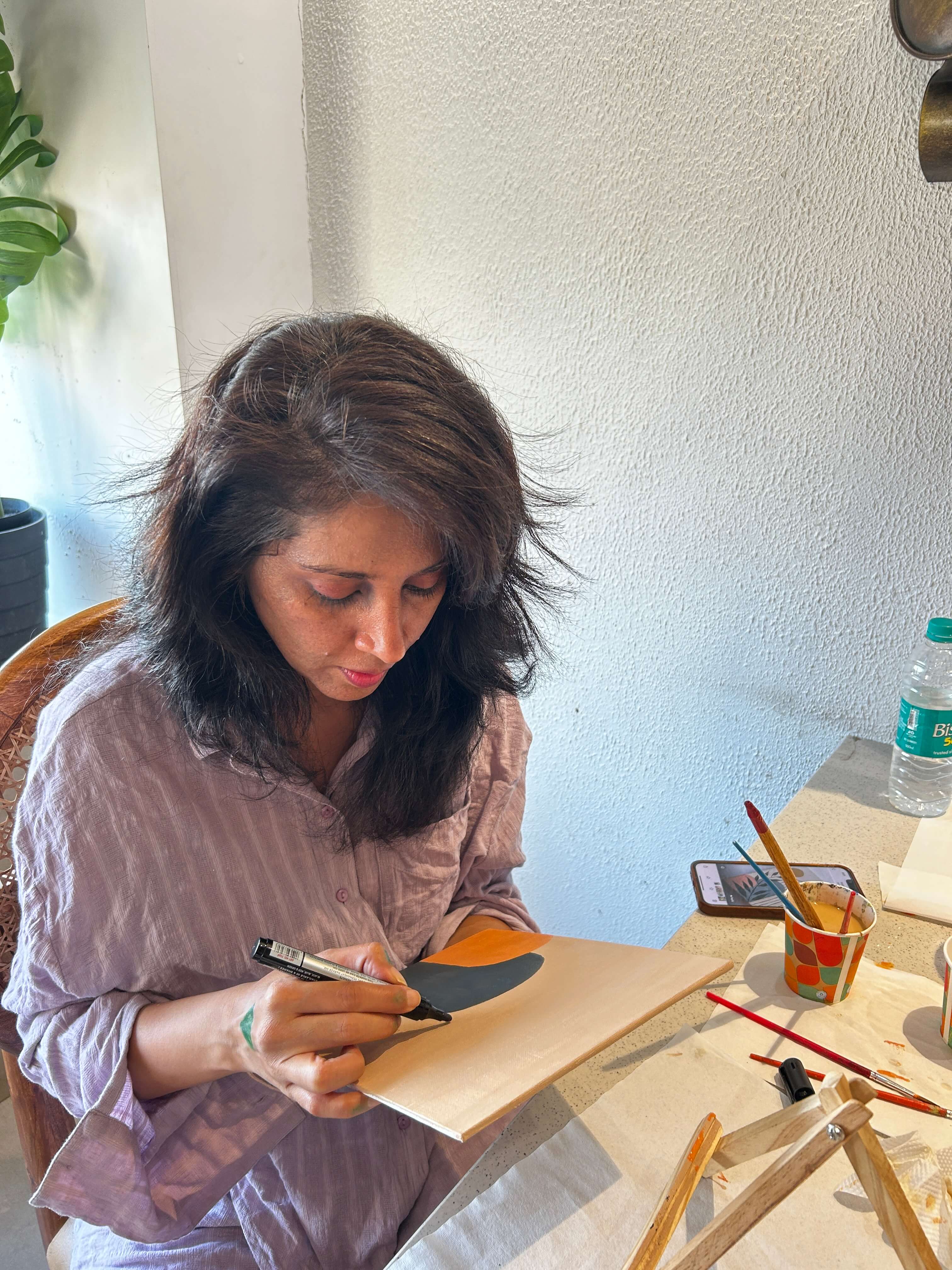 An intricate and textured Boho art piece on a canvas