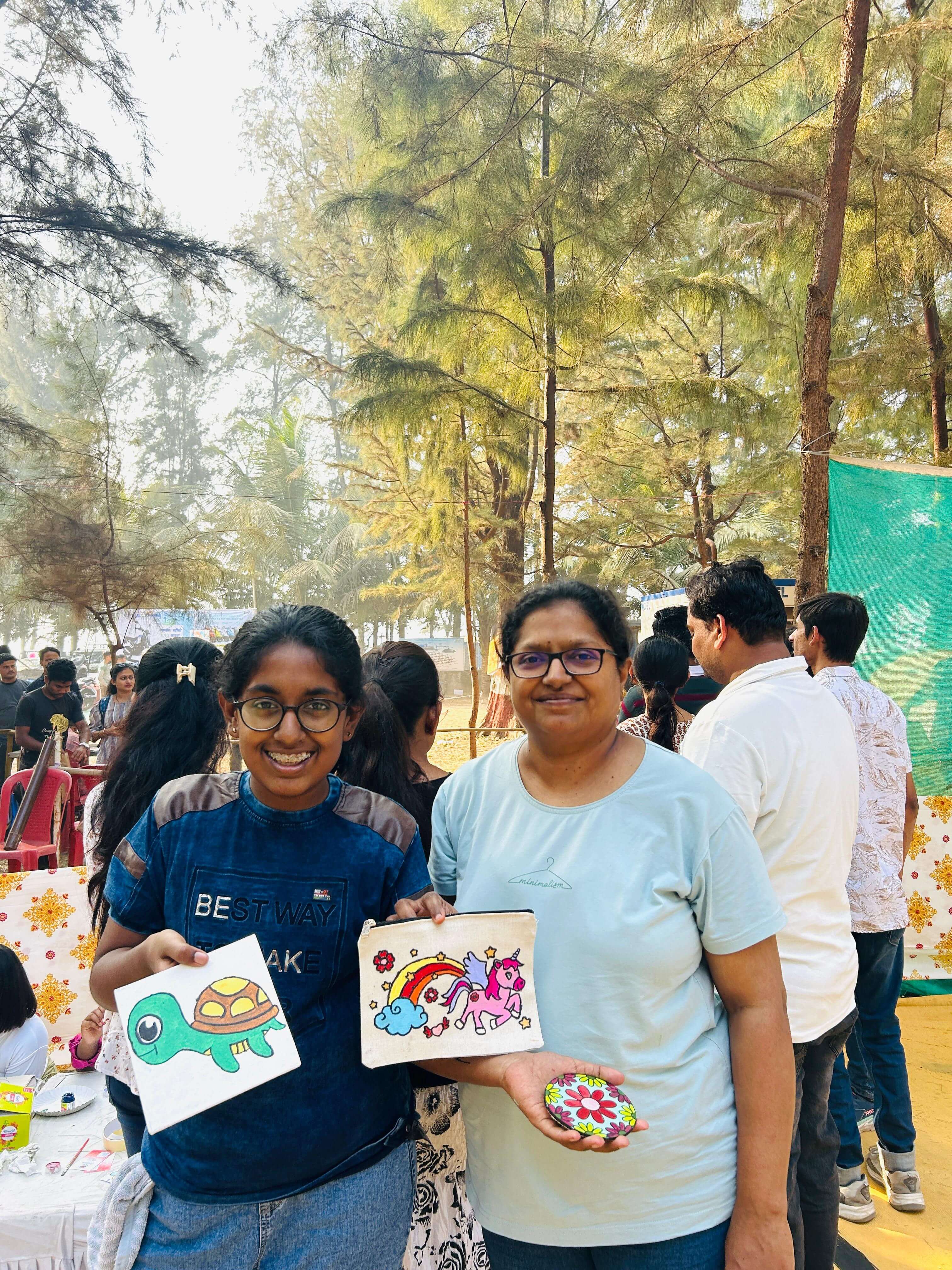 A young artist painting at the Art Corner during the Chickoo Festival
