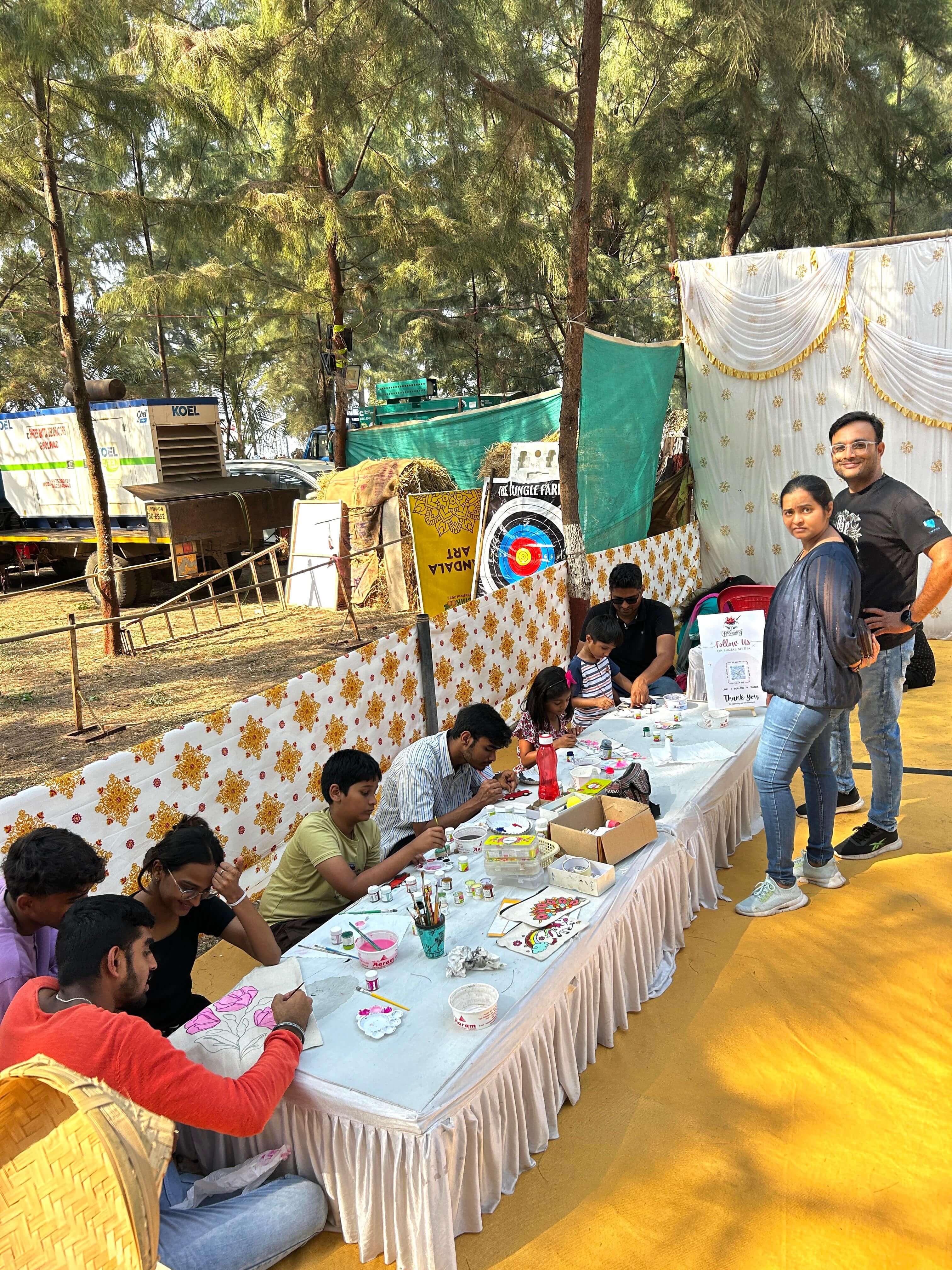 Colorful artwork displayed at the Chickoo Festival Art Corner