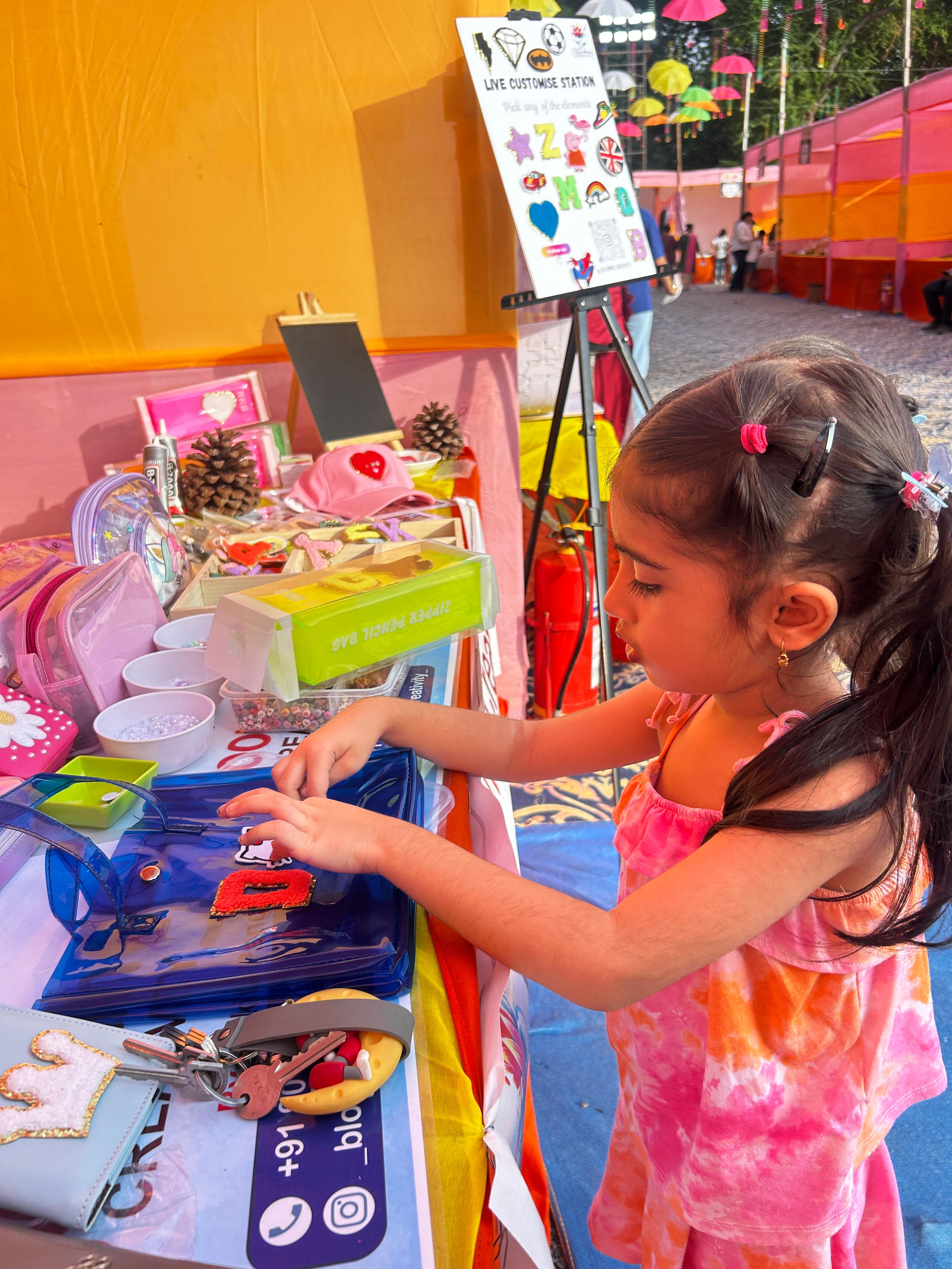 Crafting personalized pencil zipper boxes at the Vapi event