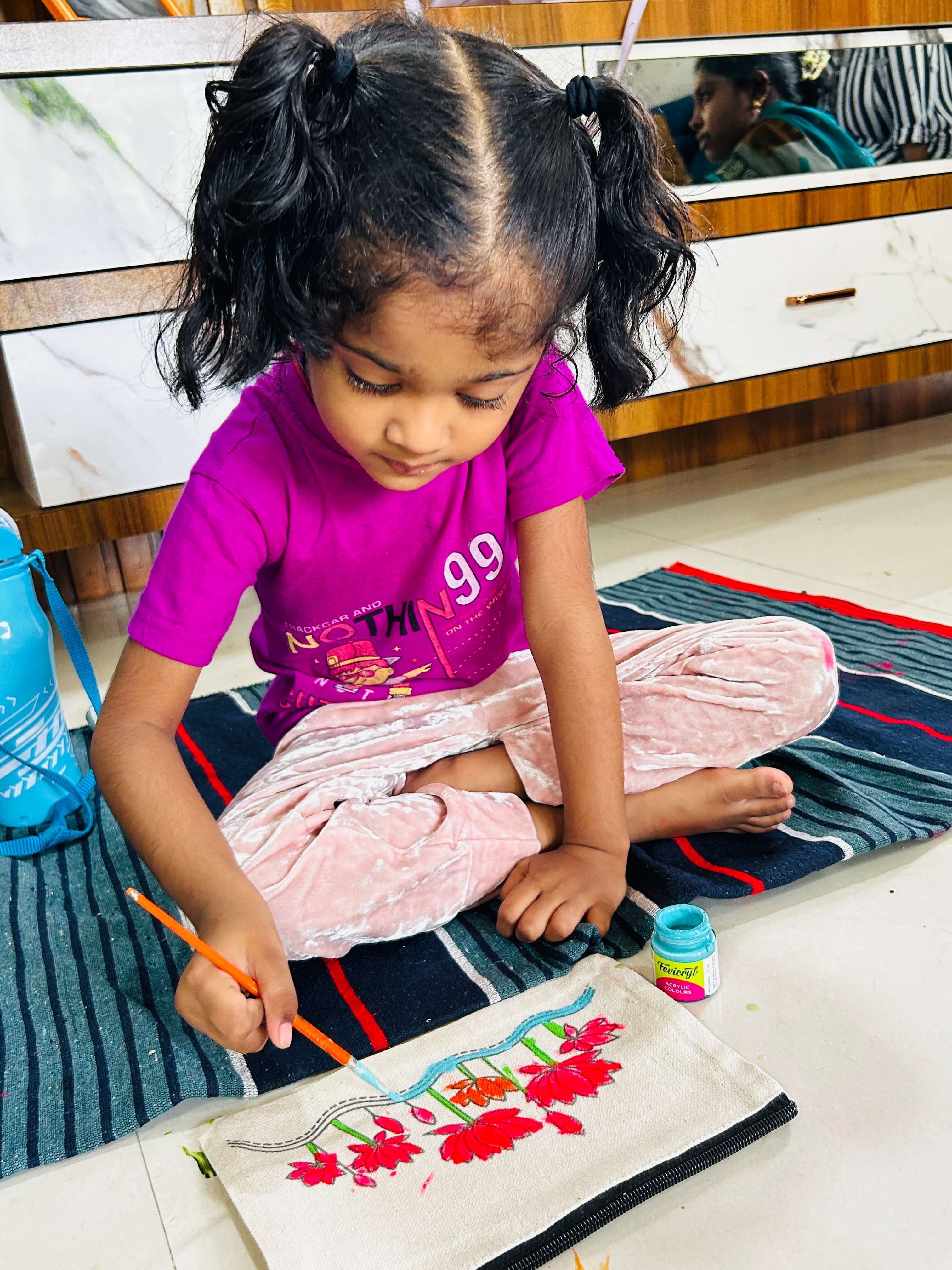 A collection of uniquely designed tote pouches from a painting workshop