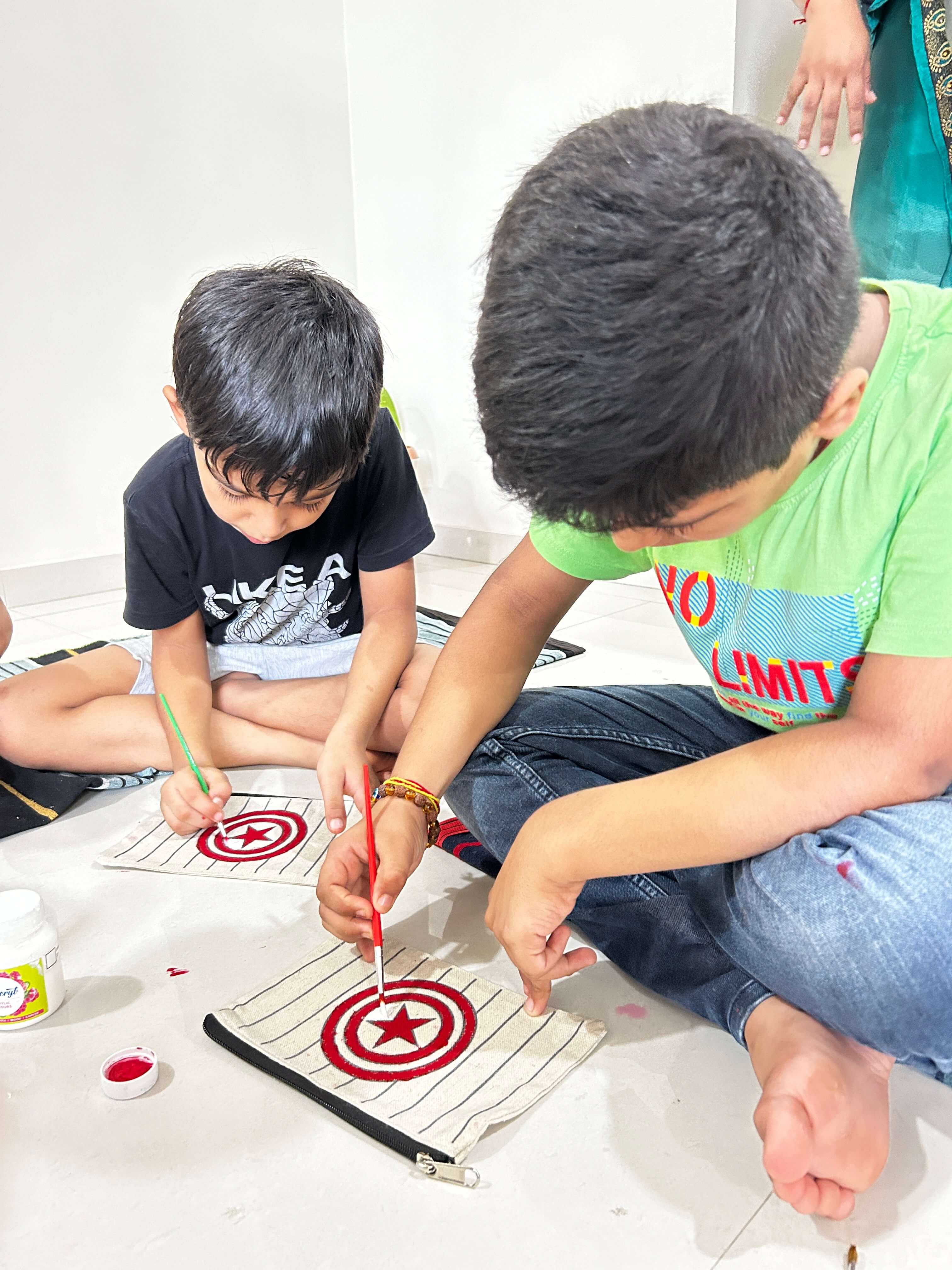 A participant proudly displaying their personalized painted pouch