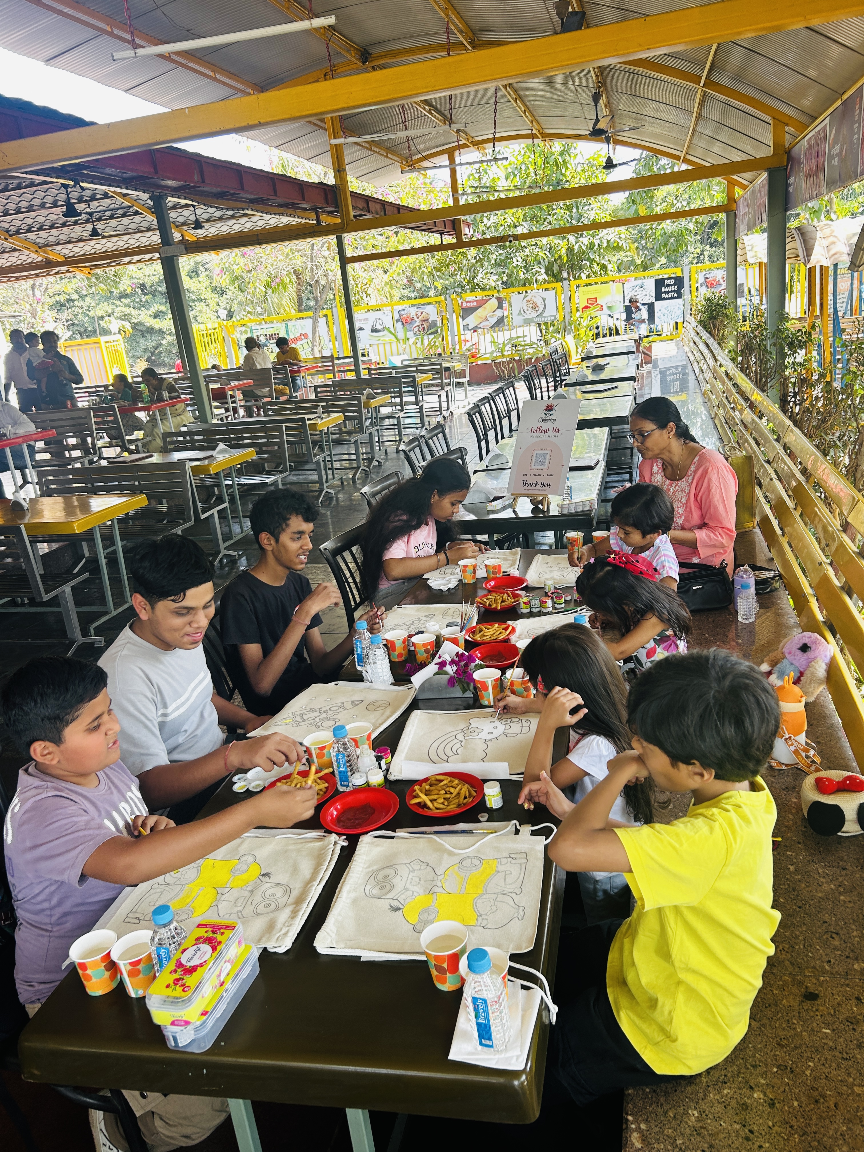 An abstract and colorful design hand-painted on a string bag